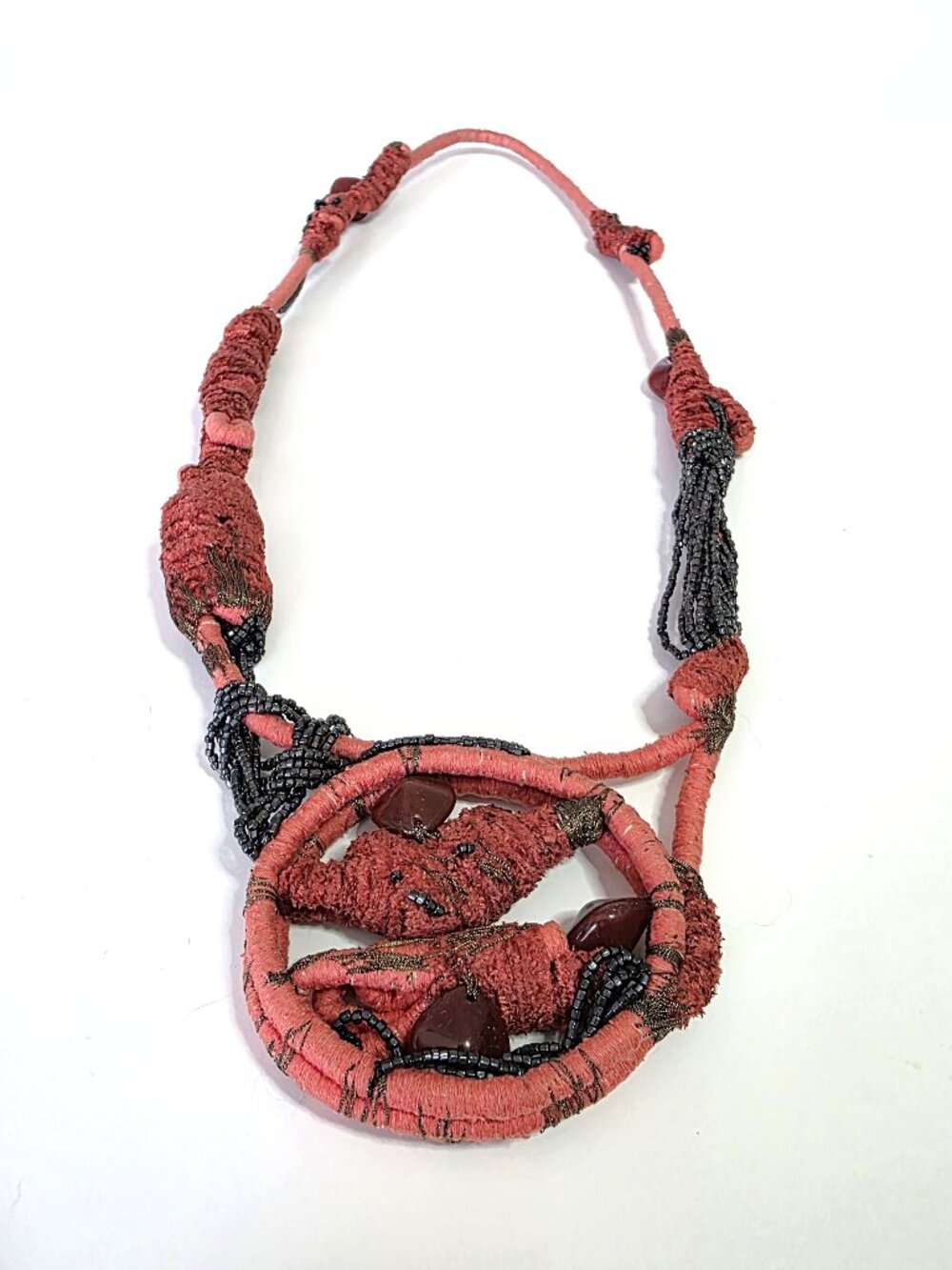 Coral & black beaded fibre art necklace
